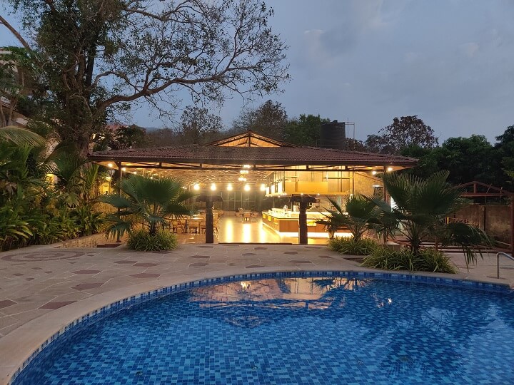 Poolside and lawn corporate event space at Woodstock Acres near Mumbai